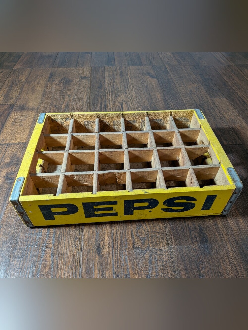 A vintage wooden Pepsi-Cola bottle crate